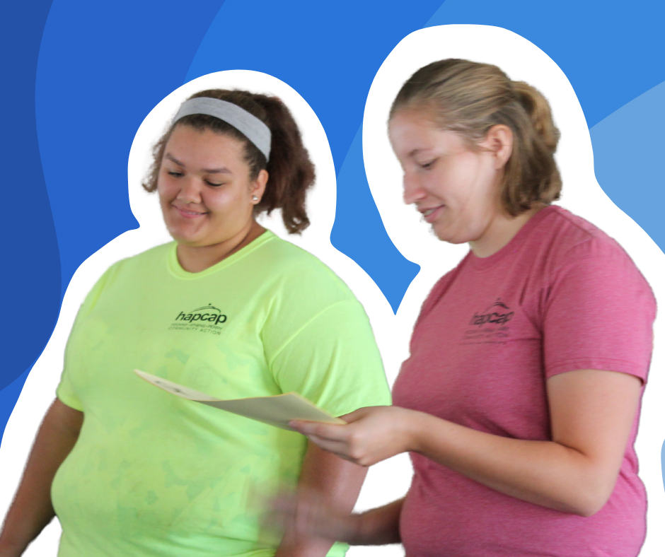 Photo of Amy and a CCMEP participant in HAPCAP shirts
