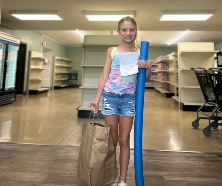 Girl with Summer Meals Bag and Pool Noodle