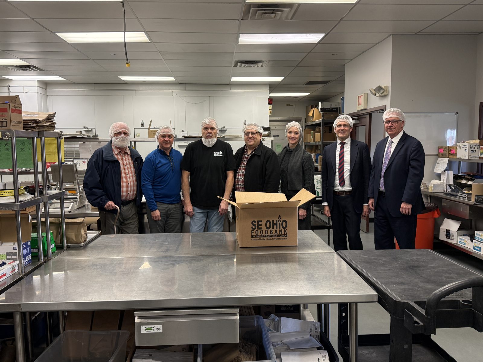 photo of 6 representatives from the church and a se ohio foodbank kitchen worker